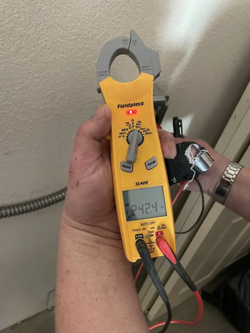 Voltage testing with clamp meter during Outlet Installation in Georgetown